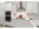 Close-up of white cabinets, stainless appliances, and gas cooktop in a well-lit kitchen at 198 Steepbrook Dr, Summerville, SC 29486