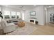 Inviting living room with a cozy fireplace and stylish decor with plenty of natural light at 198 Steepbrook Dr, Summerville, SC 29486