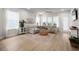Bright living room with large windows, neutral decor, and comfortable seating area at 198 Steepbrook Dr, Summerville, SC 29486