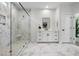 Modern bathroom features a glass-enclosed shower, sleek vanity, and stylish marble flooring at 2026 Sea Water Dr, Charleston, SC 29412