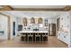 Well-lit kitchen featuring white cabinets, stainless steel appliances, a large island, and wood beam accents at 2026 Sea Water Dr, Charleston, SC 29412