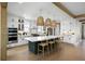 Bright, open kitchen with a large center island, white cabinets, and pendant lighting at 2026 Sea Water Dr, Charleston, SC 29412