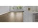 Clean bathroom area featuring wood-look floors, white walls and trim and a pedestal sink at 206 Terrace View Dr, Summerville, SC 29486