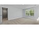 Bedroom featuring neutral carpet, a window and access to the upper level at 206 Terrace View Dr, Summerville, SC 29486