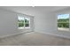 Sunlit bedroom with two large windows offering natural light and neutral carpet floors at 206 Terrace View Dr, Summerville, SC 29486