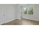 Bright hallway featuring wood-look flooring, white walls and trim, a window and a stairway at 206 Terrace View Dr, Summerville, SC 29486