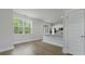 Bright living space with a kitchen area, featuring white cabinets, stainless appliances, and a breakfast bar at 206 Terrace View Dr, Summerville, SC 29486