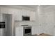 Bright kitchen features stainless appliances, white cabinets, and a stylish subway tile backsplash at 206 Terrace View Dr, Summerville, SC 29486