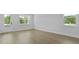 Bright living room with natural light, wood-look floors and a white door leading to the exterior at 206 Terrace View Dr, Summerville, SC 29486