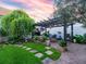 Outdoor living space with a pergola, grill, and lush landscaping at 206 White Gables Dr, Summerville, SC 29483