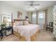 Comfortable bedroom with a four-poster bed, neutral walls, and two windows with decorative curtains at 206 White Gables Dr, Summerville, SC 29483