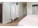 Bedroom with a tall dresser with brass hardware, and a view into the hallway at 206 White Gables Dr, Summerville, SC 29483