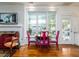 Comfortable dining space with large windows, a fireplace, and access to the outdoors at 206 White Gables Dr, Summerville, SC 29483
