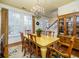 Well-lit dining room with a chandelier, a wooden table, and ample natural light at 206 White Gables Dr, Summerville, SC 29483