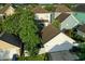 Aerial view of a home's exterior, featuring a garage and landscaped yard in a peaceful neighborhood setting at 206 White Gables Dr, Summerville, SC 29483