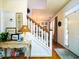 Bright foyer featuring a staircase, console table, and view into an adjacent room at 206 White Gables Dr, Summerville, SC 29483