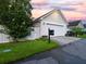 A well-maintained garage with a white door, fence, and neat landscaping, enhancing curb appeal at 206 White Gables Dr, Summerville, SC 29483