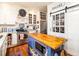 Cozy kitchen with custom cabinets, stainless steel appliances, butcher block island, and pantry at 206 White Gables Dr, Summerville, SC 29483