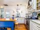 Charming kitchen features white cabinets, butcher block island, stainless steel appliances, and wood floors at 206 White Gables Dr, Summerville, SC 29483