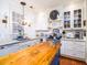 Bright kitchen with stainless steel appliances, white cabinets, and a butcher block island at 206 White Gables Dr, Summerville, SC 29483