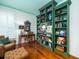 Elegant living room with hardwood floors, a teal ceiling, and a custom green bookcase at 206 White Gables Dr, Summerville, SC 29483