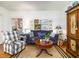 Comfortable living room with a blue sofa, armchairs, and stylish decor at 206 White Gables Dr, Summerville, SC 29483