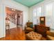 Inviting living room featuring hardwood floors, an accent chair, and natural light from large windows at 206 White Gables Dr, Summerville, SC 29483