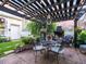 Back patio with a pergola, outdoor dining furniture, and a grill at 206 White Gables Dr, Summerville, SC 29483