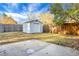 View of backyard, including a storage shed and a wooden fence at 207 Thomaston Ave, Summerville, SC 29485