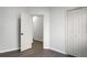 Spacious bedroom featuring modern gray floors, closet, and open doorway leading to other rooms at 207 Thomaston Ave, Summerville, SC 29485