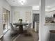 Dining area with a modern table, chairs, and a view of the kitchen at 207 Thomaston Ave, Summerville, SC 29485