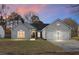 Charming single-Gathering home with a two-car garage, manicured lawn, and classic architectural details at 207 Thomaston Ave, Summerville, SC 29485