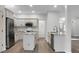 Bright kitchen featuring stainless steel appliances, an island, and modern white cabinetry at 207 Thomaston Ave, Summerville, SC 29485