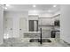 Modern kitchen with stainless steel appliances, granite countertops, and sleek gray cabinetry at 207 Thomaston Ave, Summerville, SC 29485