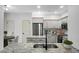 Modern kitchen with stainless steel appliances, granite countertops, and sleek gray cabinetry at 207 Thomaston Ave, Summerville, SC 29485