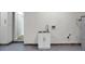 Utility sink in the garage-laundry area, features a modern faucet and cabinet at 207 Thomaston Ave, Summerville, SC 29485