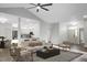 Bright living room features wood floors, a modern ceiling fan, and an open floor plan at 207 Thomaston Ave, Summerville, SC 29485