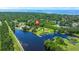 An aerial view of the property showing the surrounding canal, lush greenery, and proximity to the bay at 215 Hines Dr, Bonneau, SC 29431