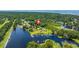 Stunning aerial view showcases the waterfront property with lush greenery and easy access to the water at 215 Hines Dr, Bonneau, SC 29431