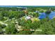 An aerial view of a community with mature trees and vegetation with access to boat landing at 215 Hines Dr, Bonneau, SC 29431