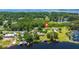 Beautiful aerial view of a lakeside home with lush greenery and private docks in a serene community at 215 Hines Dr, Bonneau, SC 29431