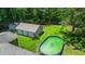 Aerial view of the property, showing the home, three car garage, and large yard with pool at 215 Hines Dr, Bonneau, SC 29431