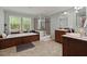 Stylish bathroom with a relaxing tub, separate glass-enclosed shower, and dual vanity sinks at 215 Hines Dr, Bonneau, SC 29431