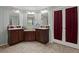 Dual vanity bathroom with separate sinks, tile flooring, and multiple mirrors with great lighting at 215 Hines Dr, Bonneau, SC 29431