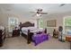 Spacious bedroom with ceiling fan, large bed, bedside tables, and plenty of room for storage at 215 Hines Dr, Bonneau, SC 29431