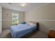 Comfortable bedroom with a queen bed, lots of natural light, and a view of the outdoors at 215 Hines Dr, Bonneau, SC 29431