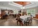 Open concept dining area features wood floors, a decorative ceiling, and is adjacent to the spacious kitchen at 215 Hines Dr, Bonneau, SC 29431