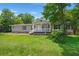 Charming single-story home featuring a welcoming front porch and well-maintained lawn at 215 Hines Dr, Bonneau, SC 29431