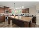 Bright, spacious kitchen with a large island, stainless appliances, recessed lighting, and ample cabinet space at 215 Hines Dr, Bonneau, SC 29431