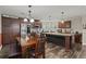 Spacious kitchen with wood cabinetry, stainless steel appliances, and a cozy dining area at 215 Hines Dr, Bonneau, SC 29431